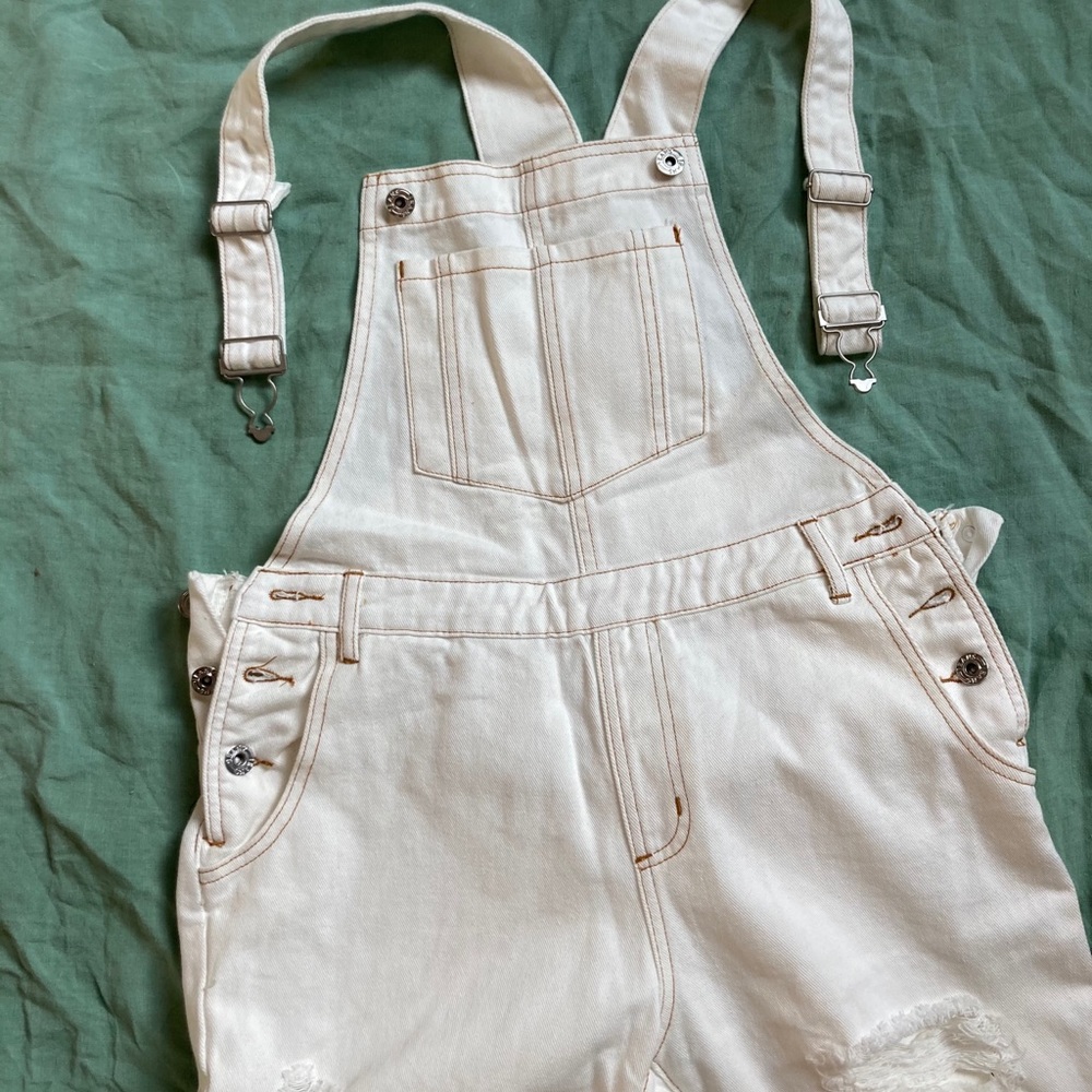 White ripped overalls